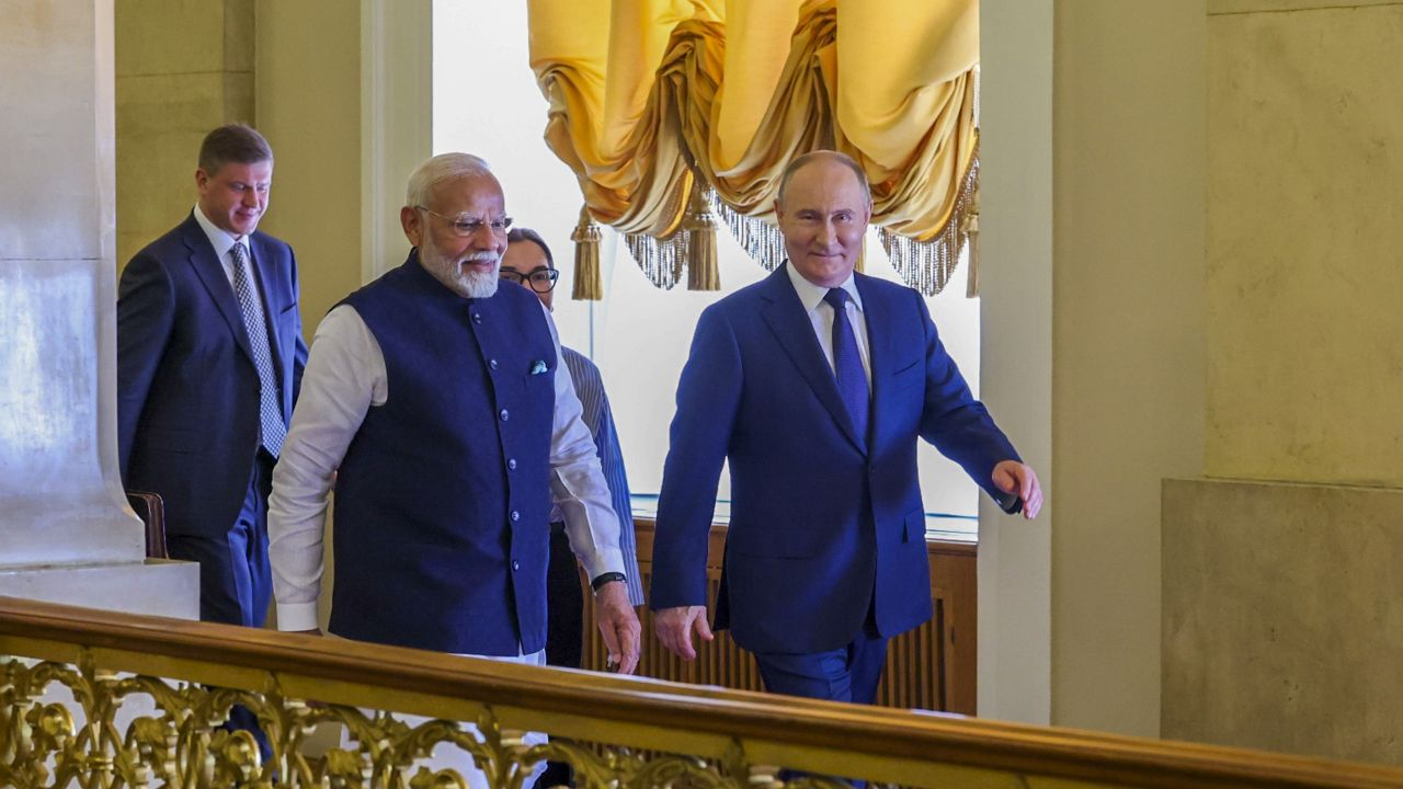 pm narendra modi and vladimir putin । Photo Credit: PTI
